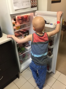 The Kaden we know, looking in the fridge to see what he wants to eat
